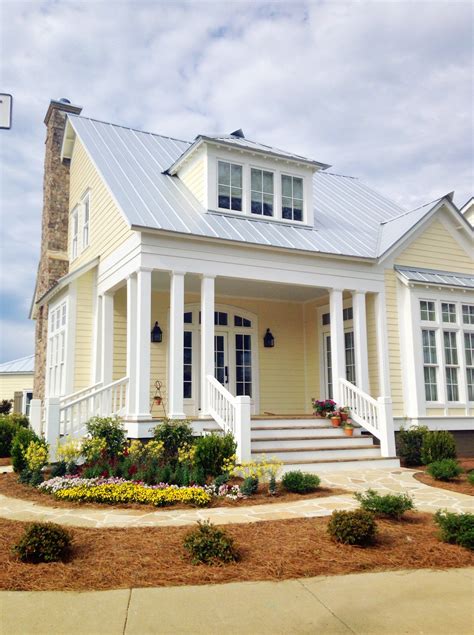 yellow house with metal roof